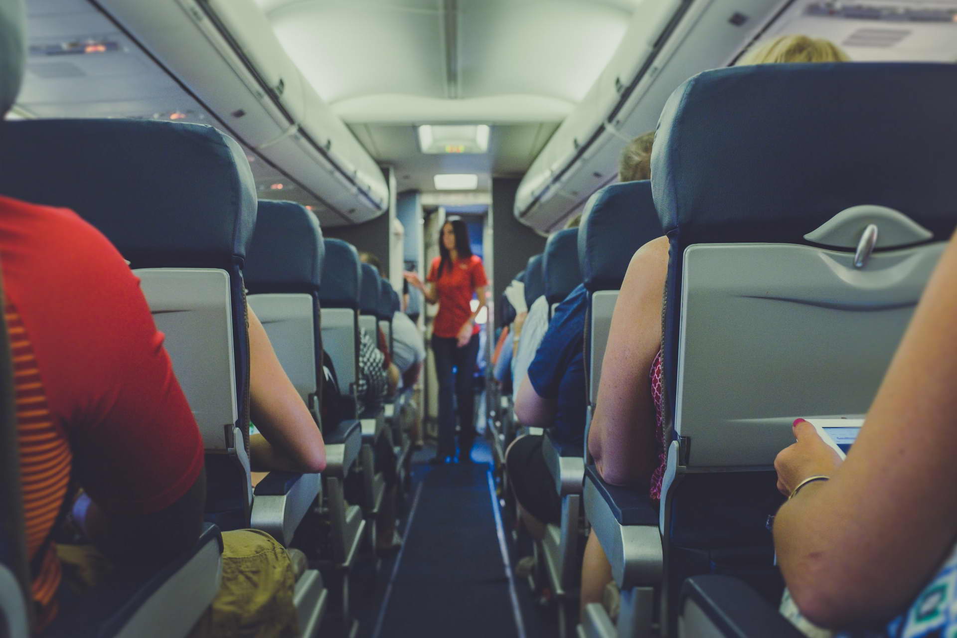 Passenger in a flight attendant jumpseat - Cabin Safety Made Easy