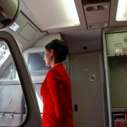 Passenger in a flight attendant jumpseat - Cabin Safety Made Easy